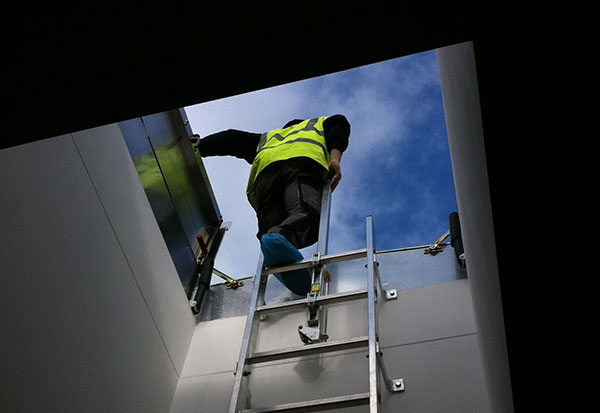 LadderUP Safety pole for easy access through a roof hatch or floor door from a fixed ladder